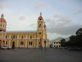 Cathedral of Granada, Nicaragua, with mountains in the background – Best Places In The World To Retire – International Living